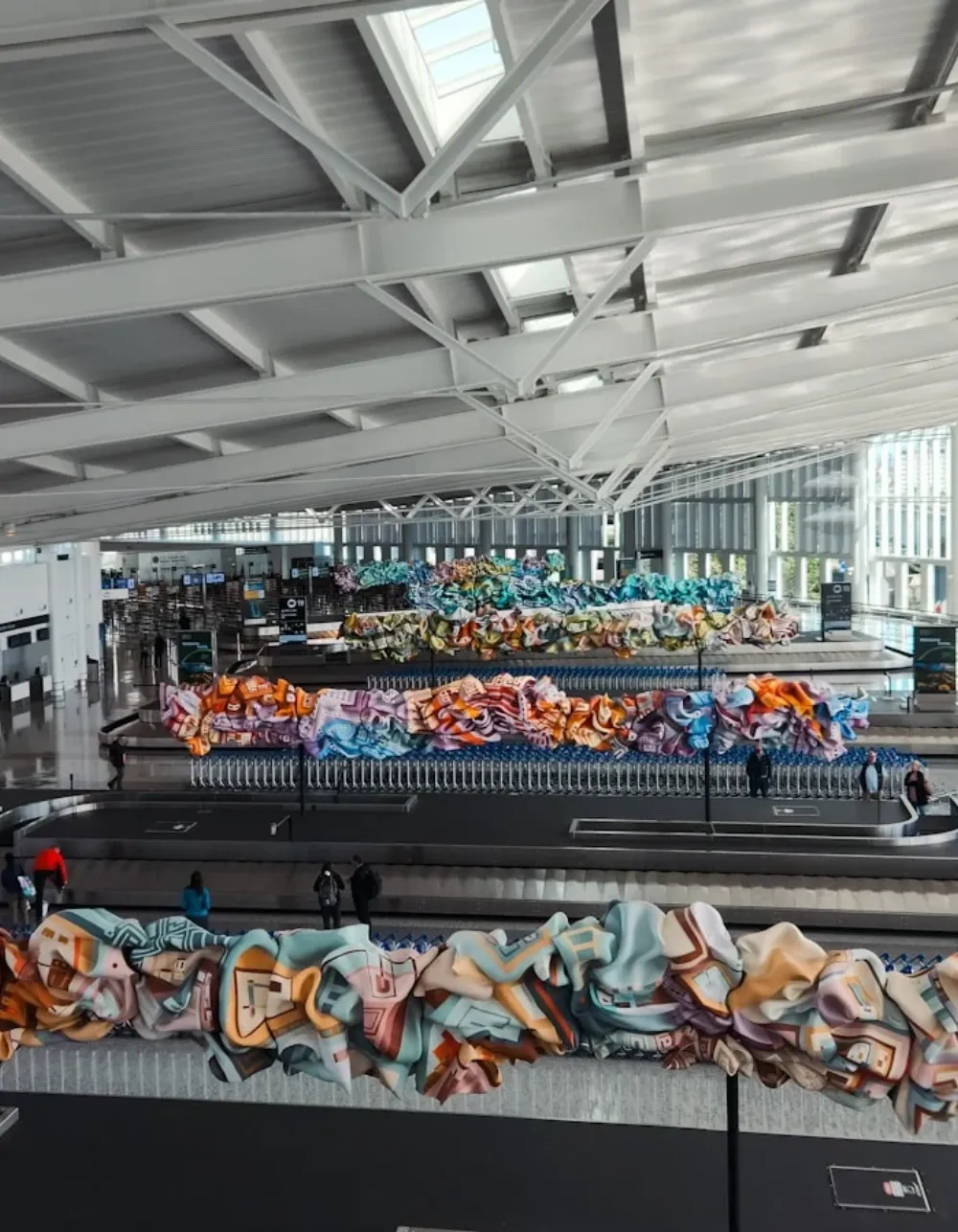 Architectural baggage claim hall with sculptural art installation