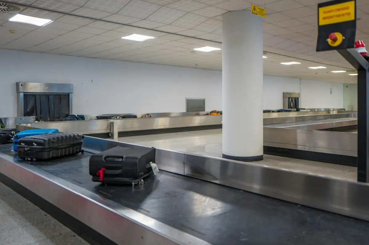 Suitcases on an airport baggage claim carousel